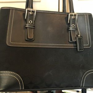 Coach black leather w/classic “c” fabric.